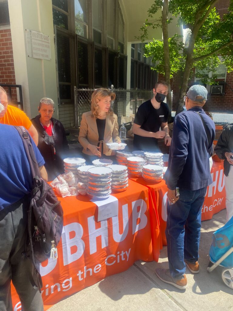 Photo of New York City Council Member Julie Menin (District 5) distributes meals at The Stanley M. Isaacs Center on May 25, 2022.